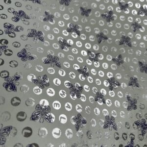 Chute de cuir blanc motifs papillon